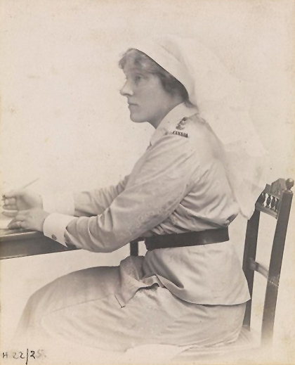 A person in a uniform sitting at a desk AI-generated content may be incorrect.